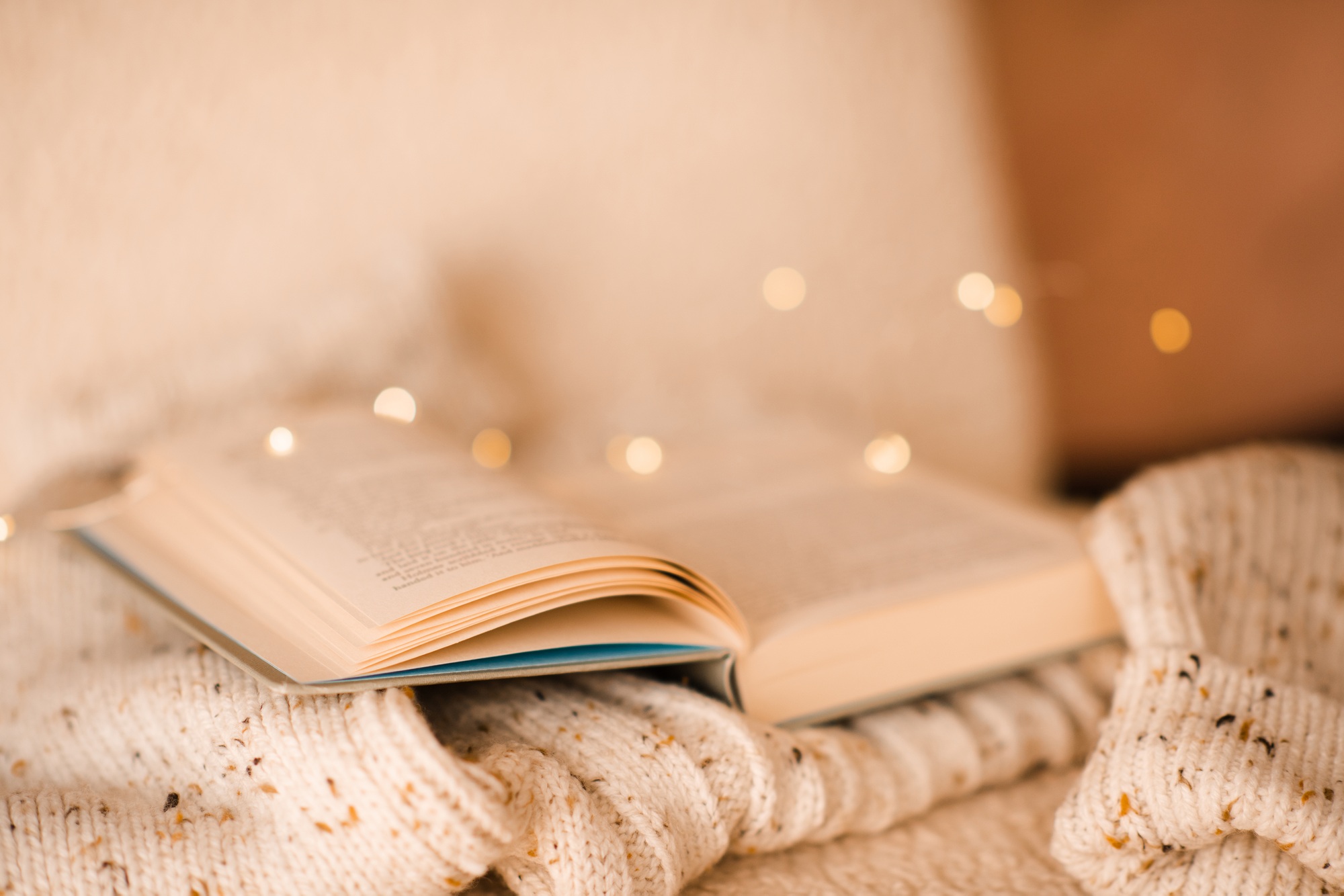 Open book with magic glow lights at background
